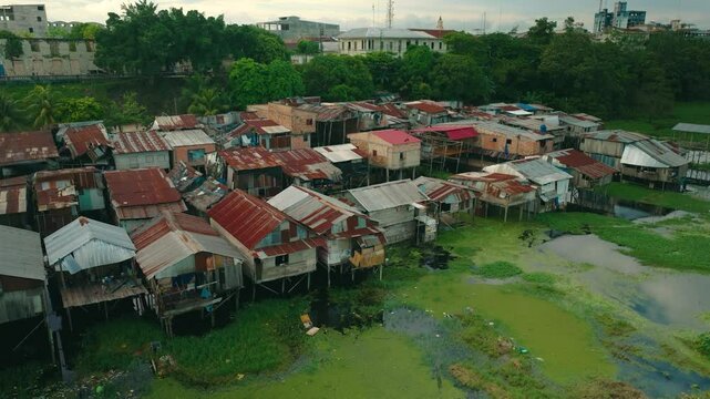 Aerial View of Wooden Stilt Houses on Amazon River Banks Near Iquitos