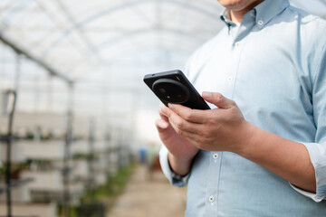 asian man in green house