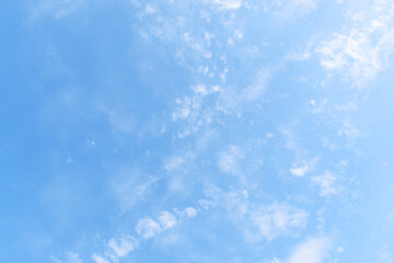 beautiful blue sky and white fluffy group of clouds with sunrise in the morning, natural background