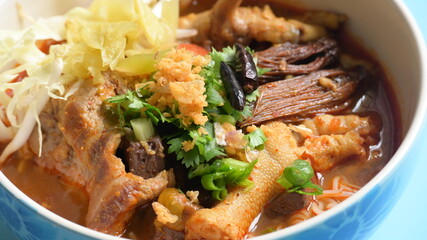 rice vermicelli with northern thai curry sauce on blue background