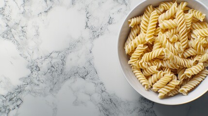 Pasta in a bowl on a marble surface