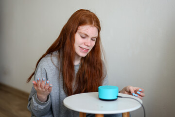 At home tech experience: girl trying to use voice assistant with confused body language