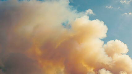 Atmospheric cloudscape featuring golden hues in a surreal sky setting