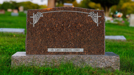 Blank granite headstone in a graveyard with no name inscribed on it