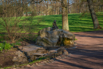 View of the fountain Girl with a jug in Catherine Park of Tsarskoye Selo on a sunny spring day,...