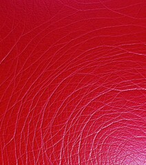 Fototapeta premium Deep crimson vintage leather, textured surface shows wear and tear, worn leather, texture, vintage background
