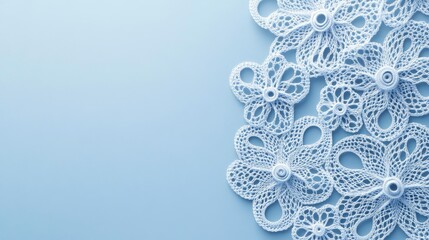 Naklejka premium Delicate Crochet Flowers on Blue Background with Empty Space for Text