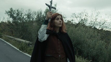 Christian Religious Rite Procession With Young Woman Holding A Crucifix Of Jesus