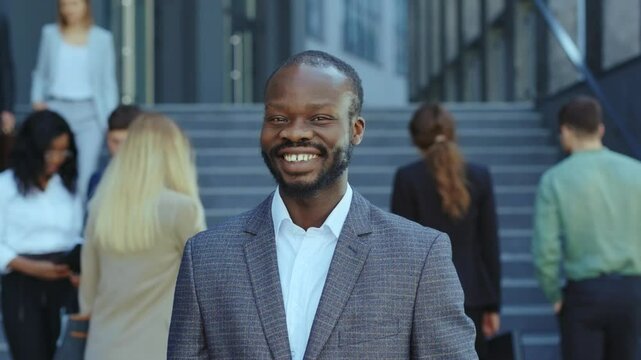 A confident businessman in an urban setting, showcasing style, professionalism, and charisma