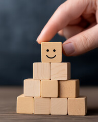 Obraz premium Customer service evaluation and satisfaction survey concepts. The clients hand-picked the happy face smile face symbol on wooden blocks, feedback review, rating excellent. positive