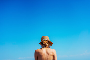 girl in a swimsuit on the shore of Lake Kapchagay. colored swimsuit on a girl