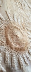 Close up of human ear against a textured off-white background.