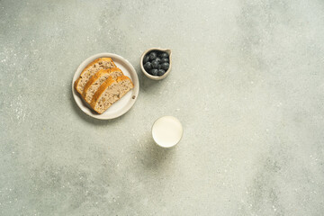 Top view of toast with milk on light grey background.