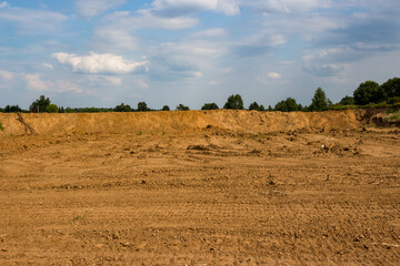 A plot of land leveled and cleared by a tractor