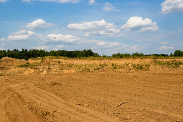 A plot of land leveled and cleared by a tractor