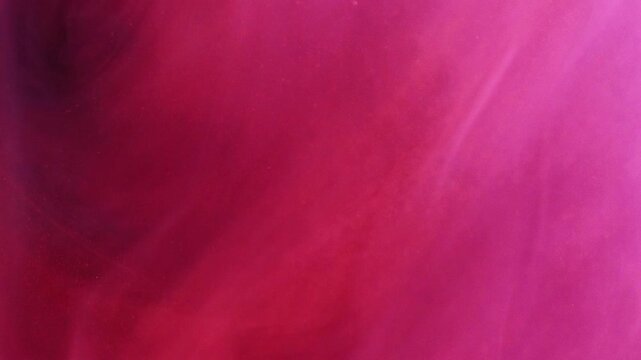 Abstract color. Swirling ink. Defocused bright pink purple paint mist cloud vortex smoke vapor steam moving on art background.