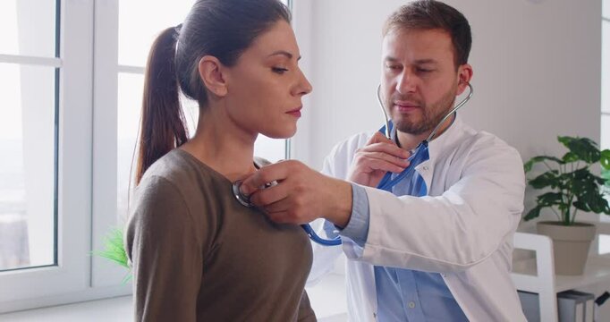 Doctor stethoscope listening to breathing, heart, lungs, female health care, clinic checking up exam, patient healthcare hospital professional controlling physical well-being, helping adult