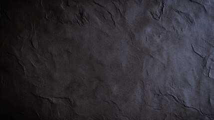 Textured dark surface with handmade appearance, ideal for backgrounds or crafts