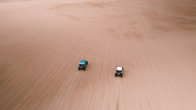 Aerial View of Two Buggies Riding Through Ica Desert, Peru, in Cloudy Weather