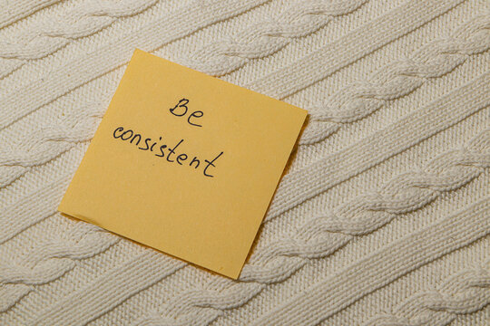 Reminder note on a textured surface encourages consistent habits in daily life