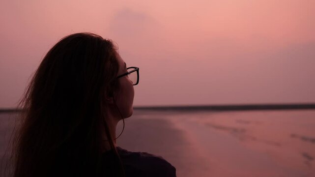 The Serene Sunset Reflections by the Beautiful Shoreline Make for a Tranquil Experience