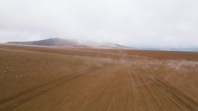 Aerial view of a steaming desert landscape after snowfall near &Aacute;rbol de Piedra, Siloli Desert, Bolivia