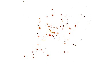 Dried red chili powder flying. Grainy scatterings of spicy burst . Splashes of red pepper powder.Overlay effect chilli or paprika spice splatters.