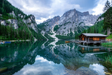 Lago Di Braies Majestic Reflection In The Dolomites Italy With Wooden Boathouse