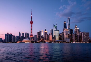 Obraz premium Shanghai skyline at dusk reflecting in the water 