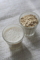 oat milk in a glass on a table