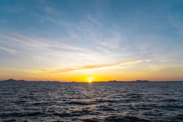 Obraz premium Beautiful morning or evening blue and orange sky with cloudy while sunsets or sunrises was taken at the sea used as natural background texture