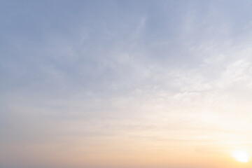 Full frame of beautiful morning or evening blue and orange sky with cloudy while sunsets or sunrises taken at the sea used as natural blackground texture