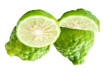 Side view of fresh green bergamot fruits or kaffir lime with half and slice or quarter in stack...