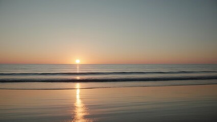 Naklejka premium Stunning sunset over calm ocean waves, reflecting vibrant colors in the tranquil water.