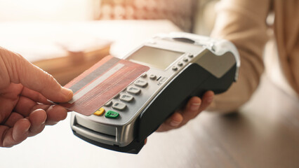 Customer paying with credit card reader
