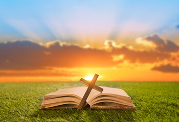 Holy Bible and Christian cross on a sunny day. Blessing and prayer.