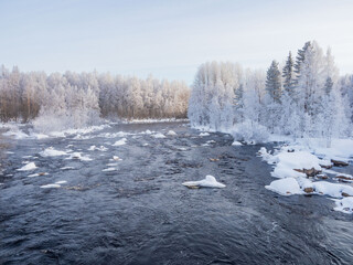Winter landscape in the Republic of Karelia, northwest Russia: snow, frost, hoarfrost on trees,...