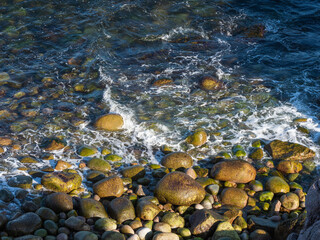 View of the coastline with big stones in Teriberka, on the Barents Sea in the Murmansk region of northern Russia