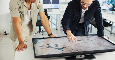 Engineer, people and hands with world map on screen for turbine location, power development and...