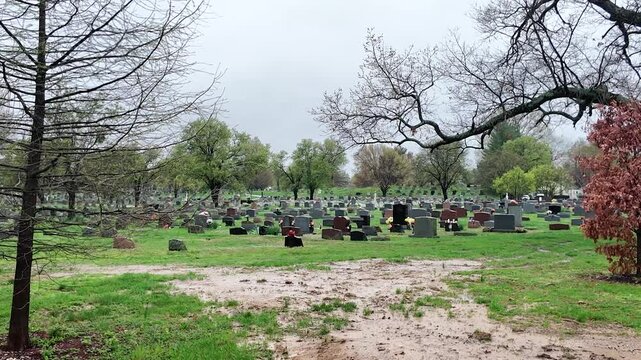 Cemetery gloomy day medium shot pan R to L