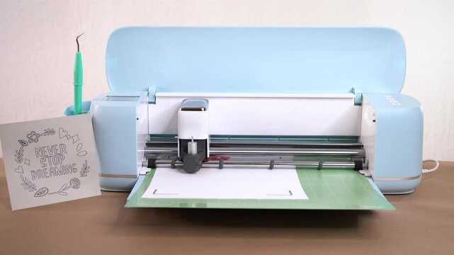 Cutting custom stationery in design workshop