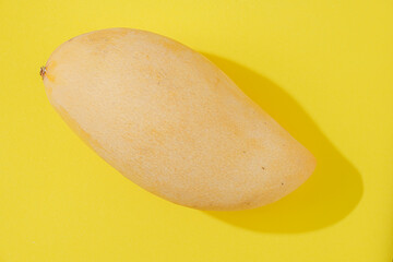 Ripe Mango on a Yellow Background.