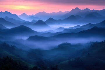 Obraz premium Misty sunrise over layered mountains and rice terraces, a breathtaking, serene landscape.