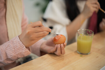 Creative Art Session for Children: Hands-on Painted Egg Crafting with Colorful Paints and Juicy Beverage in a Bright Indoor Space