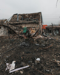Civilian population. Consequences of shelling of a residential building in Ukraine. Destroyed roof,...
