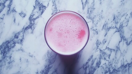 Pink Frothy Beverage on Marble Background Top View