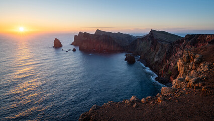 Panoramic view of sunrise at the Madeira Island, Portugal. Ponte de Sao Lourenco peninsula viewpoint early in the morning. Landscape photograph with cloudless sky.