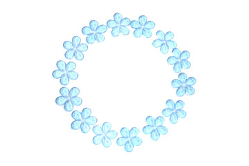 Blue plastic flowers in circle frame isolated on white