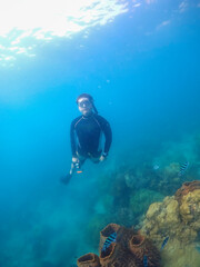 Freediver Swimming in Deep Sea DIver Eploring Sea Life.