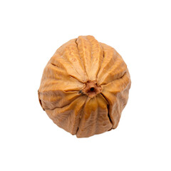 A close-up of a dried, wrinkled fruit with a natural, earthy appearance.